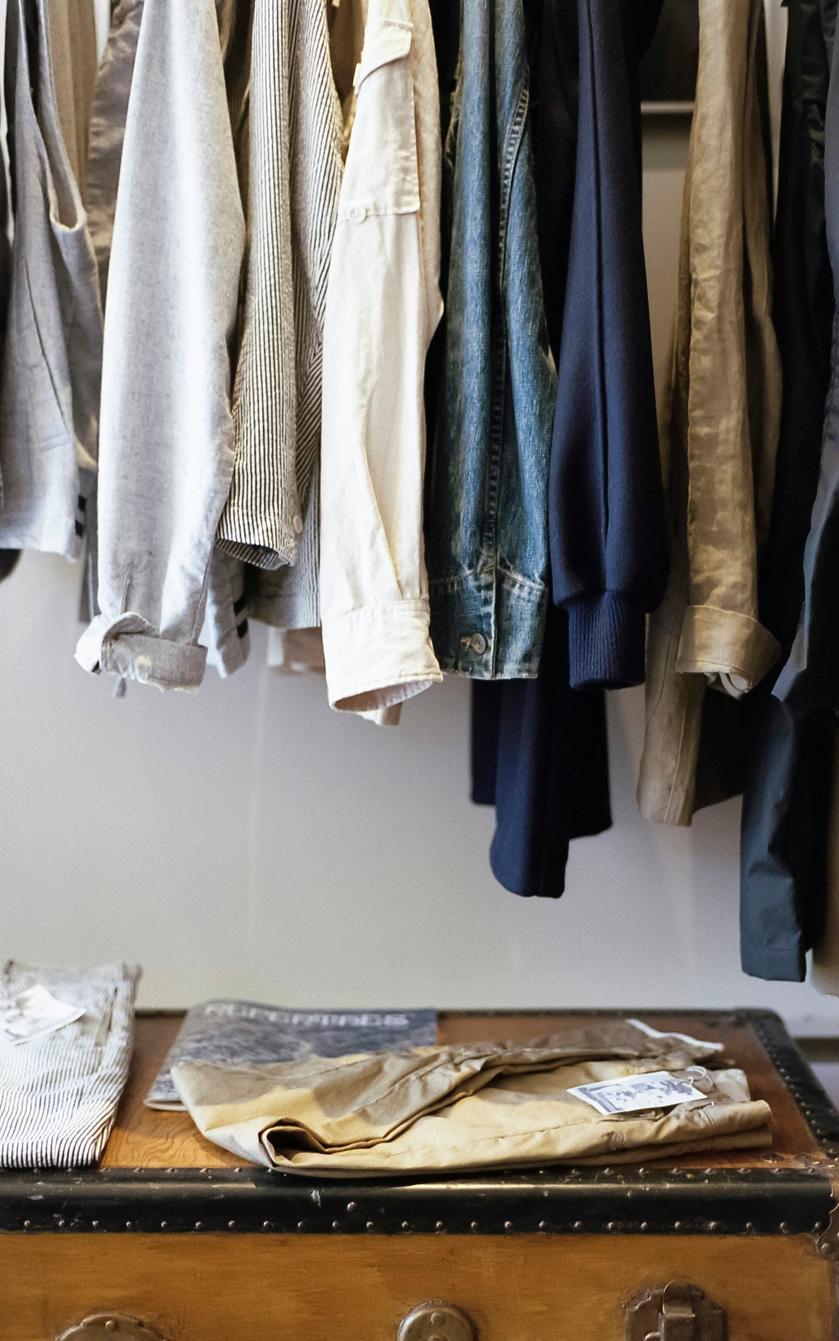 Clothes hanging in a wardrobe